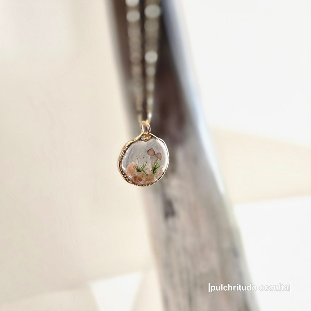 Necklace with a natural-shaped pendant featuring floral design on a light background