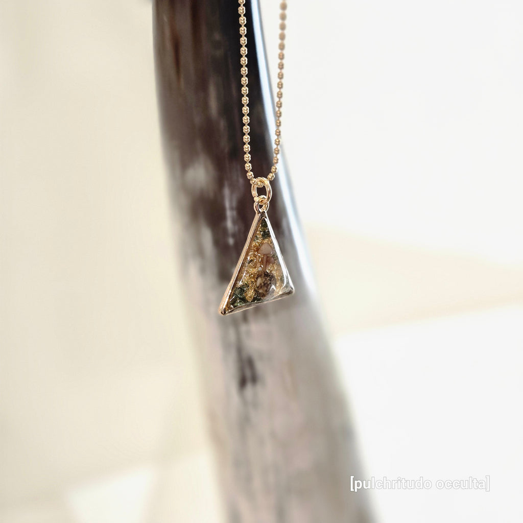 Gold necklace with a triangular pendant 