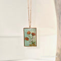 Necklace with a pendant featuring floral design on a light background