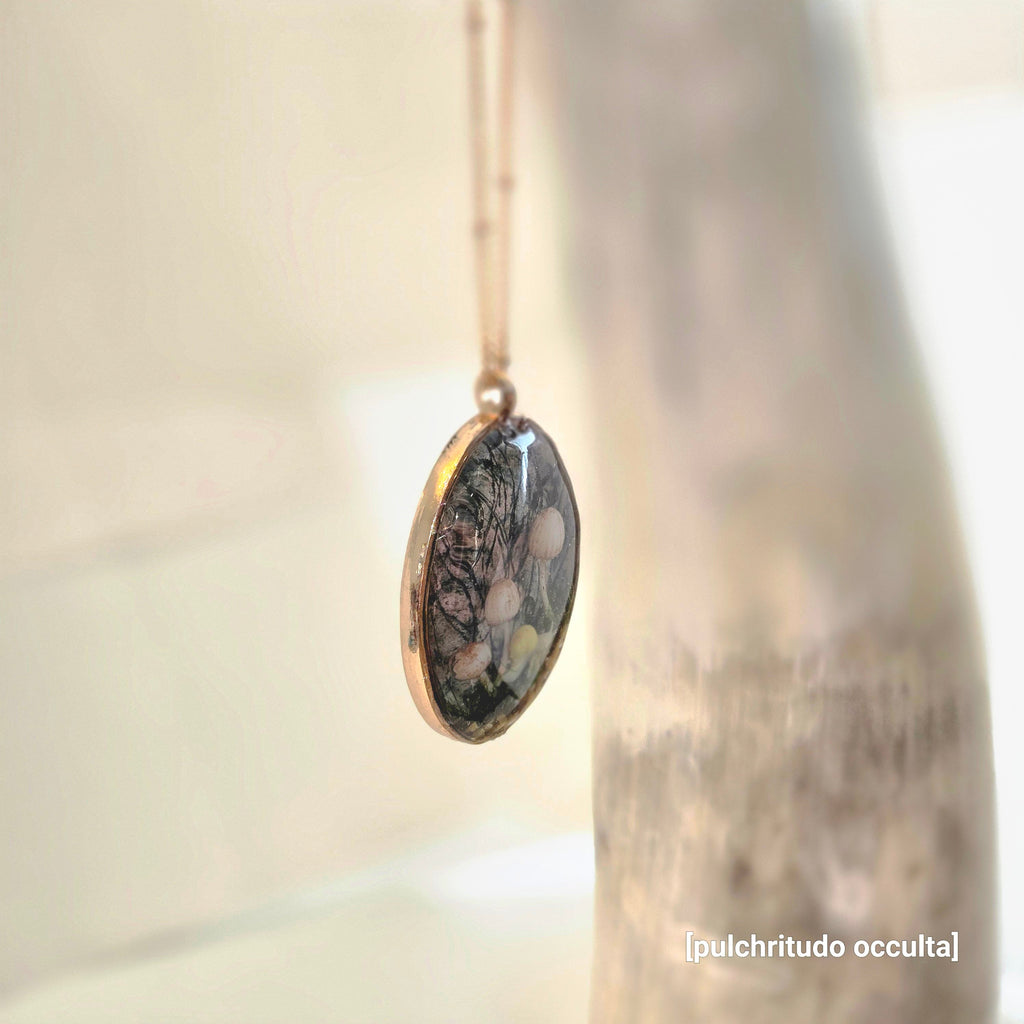 Elegant necklace with an oval pendant 3 mushrooms and a snail