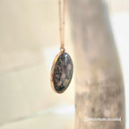Elegant necklace with an oval pendant 3 mushrooms and a snail