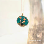 Necklace with a floral pendant on a light background