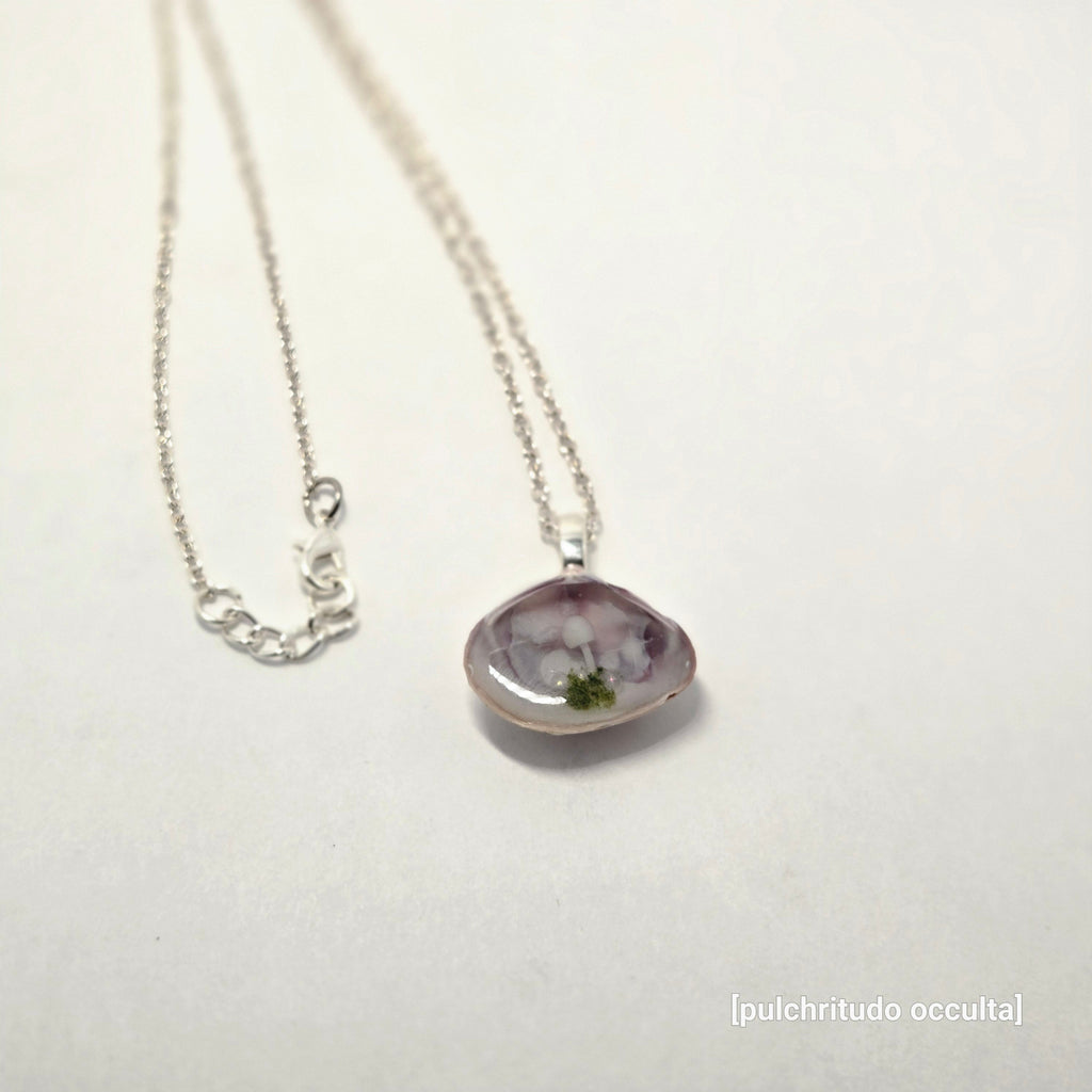 Necklace with a purple pendant on a white background