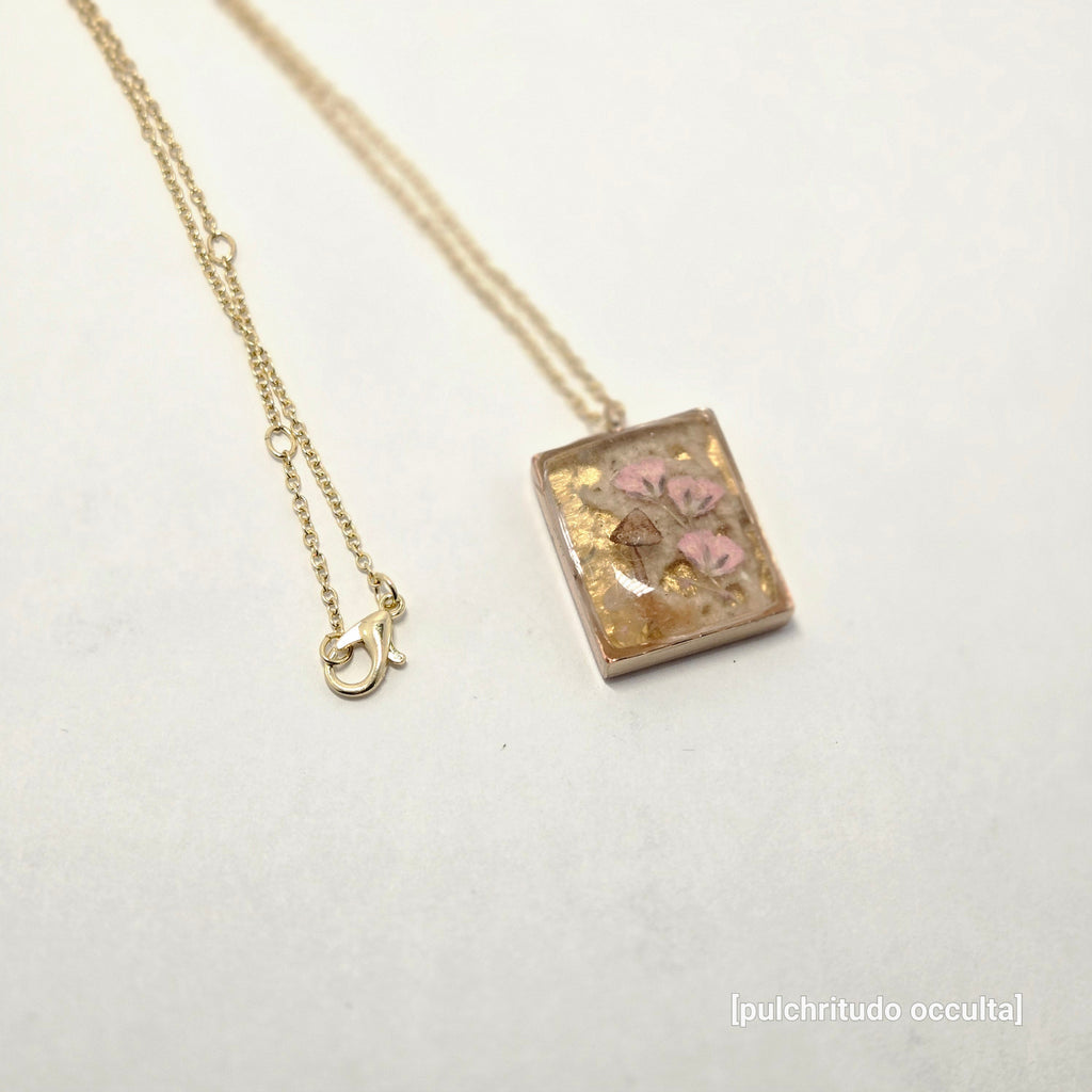Necklace with a decorative pendant on a white background