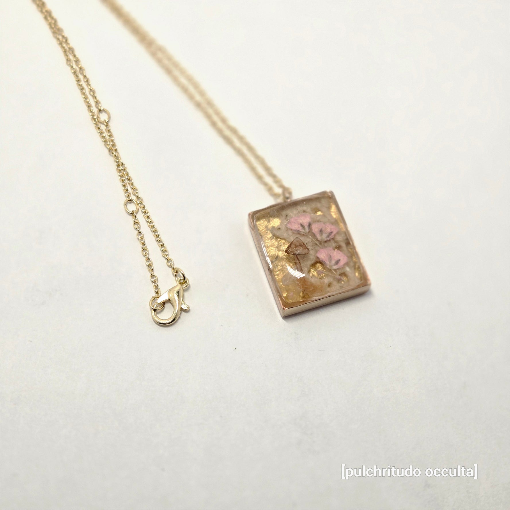 Necklace with a decorative pendant on a white background