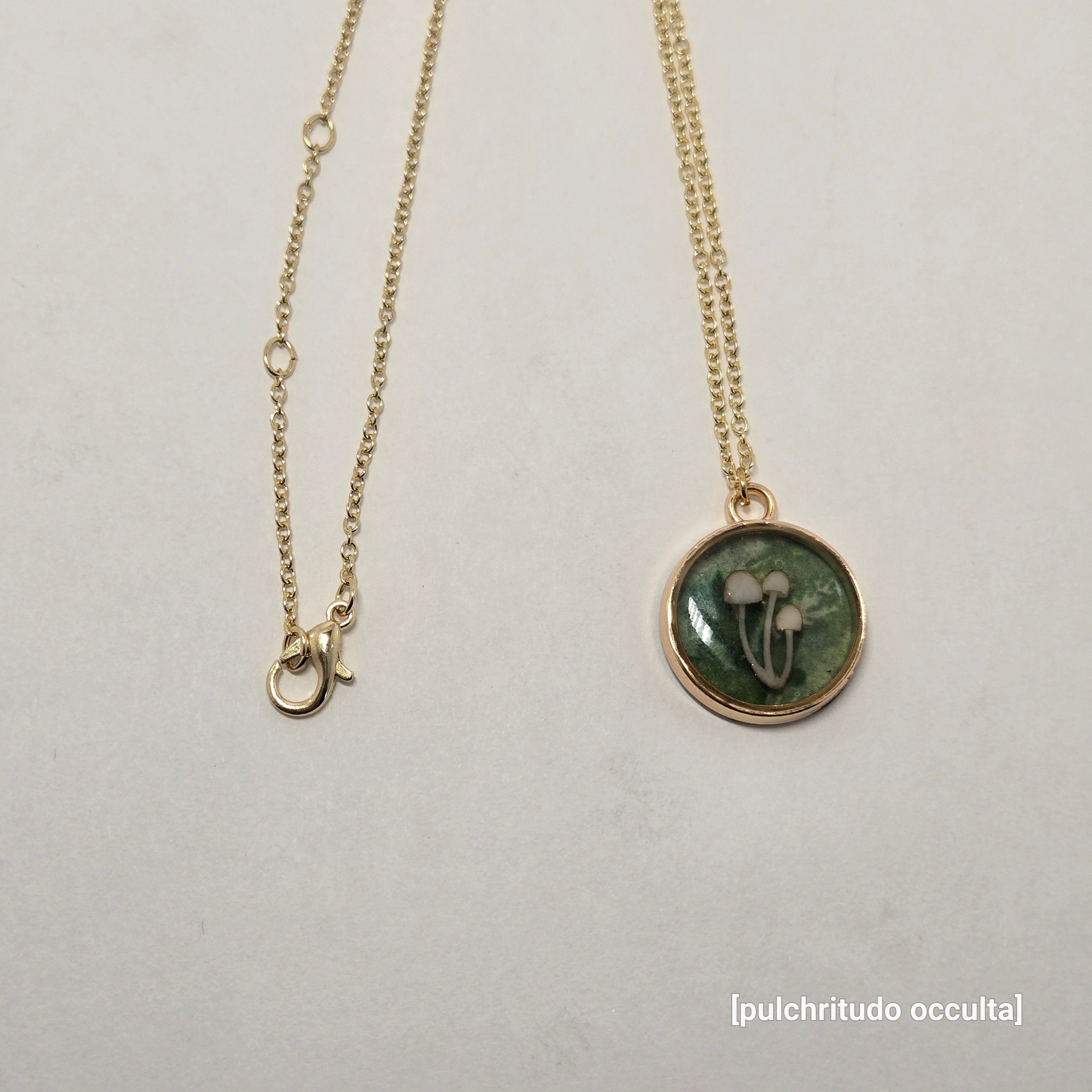 Necklace with a circular pendant on a light gray background
