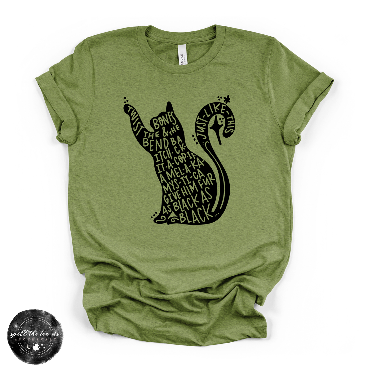 An olive green heather t-shirt with a black graphic of a cat silhouette filled with text from 'Just Like Sky' by Chappell Roan, shown on a white background with a circular watermark in the bottom-left corner.