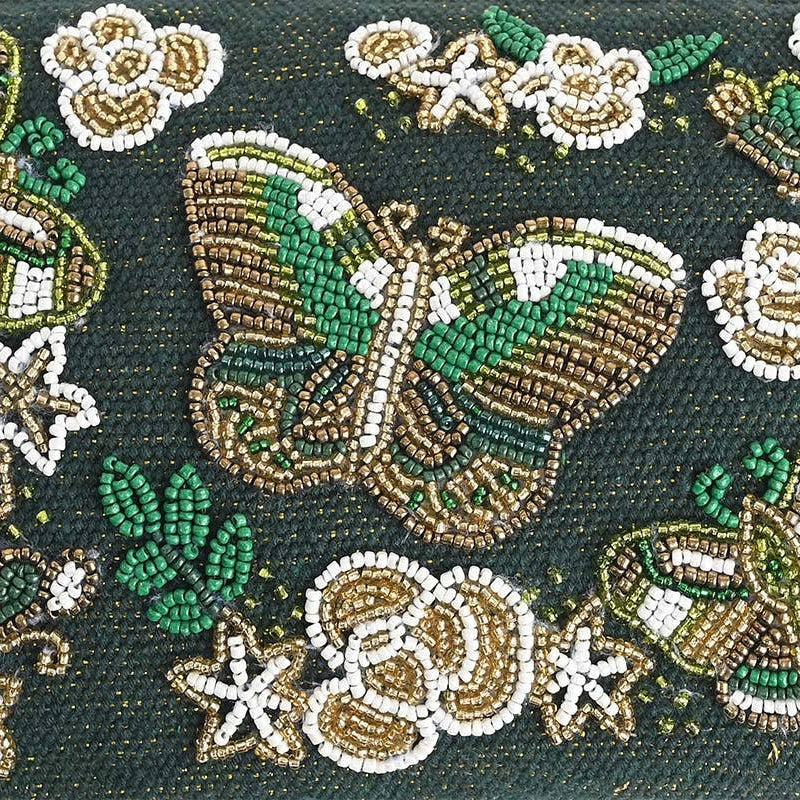 Decorative fabric with embroidered flowers and butterflies on a dark background