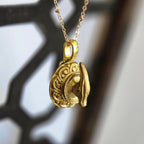 one of a kind gold tone parasaurolophus trophy necklace on ornate plaque pendant handmade