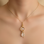 Gold necklace with a pendant on a mannequin